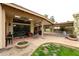 Relaxing covered patio with terracotta tiles, ceiling fans, and stylish outdoor furniture, perfect for outdoor living at 5120 E Janice Way, Scottsdale, AZ 85254