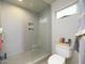 Modern bathroom featuring a glass enclosed shower and updated fixtures at 5412 E Rockridge Rd, Phoenix, AZ 85018