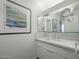 Bathroom featuring white cabinetry, sink and modern mirror at 5412 E Rockridge Rd, Phoenix, AZ 85018