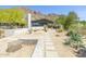Attractive home featuring desert landscaping, stone walkway, and great curb appeal at 5412 E Rockridge Rd, Phoenix, AZ 85018
