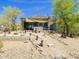 Unique home with a modern design, landscaped yard, and mountain views in the background at 5412 E Rockridge Rd, Phoenix, AZ 85018