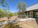 Striking home exterior featuring desert landscaping and concrete walkway at 5412 E Rockridge Rd, Phoenix, AZ 85018