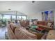 Spacious living room with large windows offering views of the desert landscape at 5412 E Rockridge Rd, Phoenix, AZ 85018