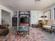 Cozy living room with a glass coffee table, decorative rug and entertainment center at 5412 E Rockridge Rd, Phoenix, AZ 85018