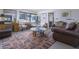 Another view of the living room featuring a glass coffee table and views to the outside at 5412 E Rockridge Rd, Phoenix, AZ 85018