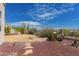 Beautiful backyard featuring desert landscaping and gravel accents at 6043 W Robin Ln, Glendale, AZ 85310