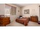 Bedroom includes window, traditional furnishings, and carpeted floors at 6043 W Robin Ln, Glendale, AZ 85310
