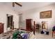 Bedroom includes ceiling fan, window, and traditional furnishings at 6043 W Robin Ln, Glendale, AZ 85310