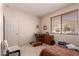 Bedroom includes window, traditional furnishings, and carpeted floors at 6043 W Robin Ln, Glendale, AZ 85310