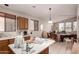 Bright kitchen features tile floors, wood cabinets, and lots of counter space at 6043 W Robin Ln, Glendale, AZ 85310