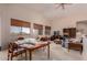 Inviting living room with high ceilings, large windows, and lots of natural light at 6043 W Robin Ln, Glendale, AZ 85310