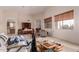 Bright living room featuring an open floorplan, large windows, and a neutral color palette at 6043 W Robin Ln, Glendale, AZ 85310