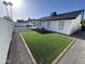This well-manicured backyard features an easy-to-maintain lawn and a covered patio area at 6217 W Comet Ave, Glendale, AZ 85302