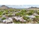 Aerial view of the community with lush desert landscaping and mountain views at 11366 E White Feather Ln, Scottsdale, AZ 85262