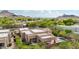 Aerial view of the home with a pool, desert landscaping, and mountain views at 11366 E White Feather Ln, Scottsdale, AZ 85262