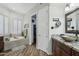 Bathroom featuring a soaking tub, wood floors, granite counters, and walk-in closet at 11366 E White Feather Ln, Scottsdale, AZ 85262