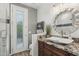 Stylish bathroom featuring a vessel sink, granite countertop, and a walk-in shower with a glass door at 11366 E White Feather Ln, Scottsdale, AZ 85262