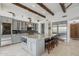 Spacious kitchen features a large island with seating, stainless steel appliances, and bright, modern finishes at 11366 E White Feather Ln, Scottsdale, AZ 85262