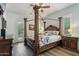 Stunning bedroom features a four-poster bed and french doors leading to outdoor space at 11366 E White Feather Ln, Scottsdale, AZ 85262
