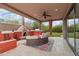 Covered outdoor living area with fireplace and bar overlooking the backyard and pool at 11366 E White Feather Ln, Scottsdale, AZ 85262