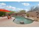 Backyard with waterfall pool and lounge seating at 11366 E White Feather Ln, Scottsdale, AZ 85262