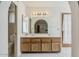 Neutral bathroom features a dual sink vanity and an archway to the bedroom at 14221 N 45Th St, Phoenix, AZ 85032