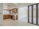 Functional kitchen featuring tile floors and access to the adjacent dining area at 14221 N 45Th St, Phoenix, AZ 85032