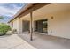 Inviting covered patio with sliding glass doors, providing seamless indoor-outdoor living and access to the backyard at 14221 N 45Th St, Phoenix, AZ 85032
