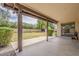 Covered patio overlooks private, fenced backyard with mature trees at 14221 N 45Th St, Phoenix, AZ 85032