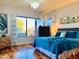 Comfortable bedroom with a large window, wood flooring, and a striking blue comforter set at 14253 N Honeysuckle N Dr, Fountain Hills, AZ 85268