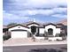Charming single-story home boasts a well-manicured desert landscape, complemented by a two car garage and a tiled roof at 14253 N Honeysuckle N Dr, Fountain Hills, AZ 85268