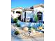 Inviting front entrance with vibrant desert landscaping and rock accents create a welcoming curb appeal at 14253 N Honeysuckle N Dr, Fountain Hills, AZ 85268