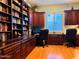 Spacious home office with custom built-in shelving and plenty of workspace for multiple users at 14253 N Honeysuckle N Dr, Fountain Hills, AZ 85268