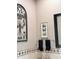 Stylish powder room with decorative metal wall art, neutral paint, and charming patterned tile at 14253 N Honeysuckle N Dr, Fountain Hills, AZ 85268
