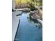 Beautiful swimming pool with rock waterfall and lush greenery, creating a serene backyard oasis at 14253 N Honeysuckle N Dr, Fountain Hills, AZ 85268