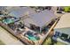 Aerial view of a backyard with a pool, patio, and outdoor kitchen, ideal for entertaining and relaxation at 1437 E Glenhaven Dr, Phoenix, AZ 85048
