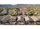 Aerial view of a residential neighborhood with mountain views and community pools at 1437 E Glenhaven Dr, Phoenix, AZ 85048