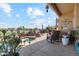 Relaxing backyard patio area with comfortable seating and a view of the inviting pool and spa at 1437 E Glenhaven Dr, Phoenix, AZ 85048