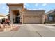 Charming single-Gathering home with a welcoming front entrance and a well-maintained driveway and desert landscaping at 1437 E Glenhaven Dr, Phoenix, AZ 85048