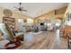Spacious living room featuring hardwood floors, vaulted ceilings, and plenty of natural light at 1437 E Glenhaven Dr, Phoenix, AZ 85048