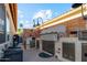 Built-in outdoor kitchen featuring stainless steel appliances and tiled accents at 1437 E Glenhaven Dr, Phoenix, AZ 85048