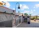 Outdoor kitchen featuring a stainless grill, storage, tiled accents, and a covered grill at 1437 E Glenhaven Dr, Phoenix, AZ 85048