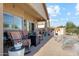 Inviting outdoor patio with comfortable seating, built-in BBQ, and access to a pool, perfect for relaxation at 1437 E Glenhaven Dr, Phoenix, AZ 85048