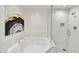 Modern bathroom with a soaking tub and a glass-enclosed shower at 16 W Encanto Blvd # 22, Phoenix, AZ 85003