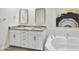 Luxurious bathroom with double vanity, granite countertops, and a soaking tub at 16 W Encanto Blvd # 22, Phoenix, AZ 85003