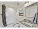 Well-lit bathroom with granite countertop, shower over tub, and modern finishes for a clean, updated look at 16 W Encanto Blvd # 22, Phoenix, AZ 85003