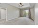 Bright bedroom with gray carpet and a sliding glass door leading to a balcony at 16 W Encanto Blvd # 22, Phoenix, AZ 85003