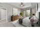 Serene bedroom with balcony access, neutral tones, and plush bedding, creating a relaxing retreat at 16 W Encanto Blvd # 22, Phoenix, AZ 85003