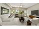 Bright living room with a cozy fireplace, large windows, and comfortable, modern furnishings at 16 W Encanto Blvd # 22, Phoenix, AZ 85003