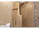 Close-up of a tiled shower with decorative shower curtain, showcasing the bathroom's stylish design and functionality at 1978 E Carver Rd, Tempe, AZ 85284